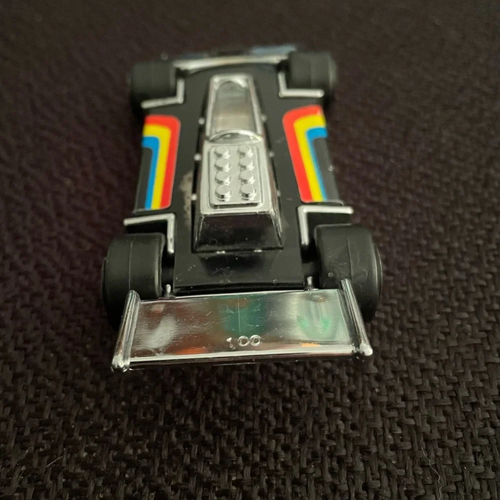 VTG 1979 Tonka black F1 race car w/ rainbow racing stripes